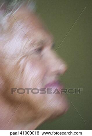 Senior man, smiling, side view, blurred View Large Photo Image Stock Photo - Senior man, smiling, side view, blurred. Fotosearch