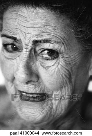 Senior woman looking into camera, close-up, portrait, b&w. View Large Photo Image Picture - Senior woman looking into camera, close-up, portrait, b&w.. Fotosearch