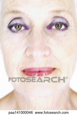 Senior woman looking into camera, portrait. View Large Photo Image Stock Photograph - Senior woman looking into camera, portrait.. Fotosearch