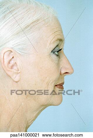 Stock Image - Senior woman, side view, close up.. Fotosearch