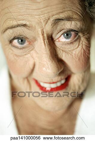 Senior woman smiling into camera, portrait. View Large Photo Image Stock Photograph - Senior woman smiling into camera, portrait.. Fotosearch