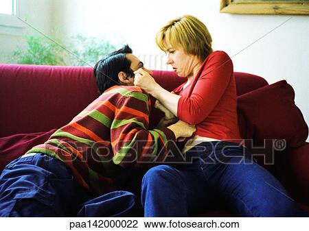 Couple on sofa fighting. View Large Photo Image Stock Image - Couple on sofa fighting.. Fotosearch