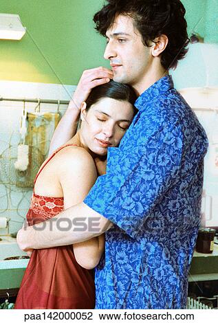 Couple standing, man holding woman, side view. View Large Photo Image Stock Image - Couple standing, man holding woman, side view.. Fotosearch