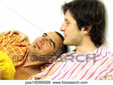 Two men, one with arm around the other, portrait. View Large Photo Image Stock Photograph - Two men, one with arm around the other, portrait.. Fotosearch