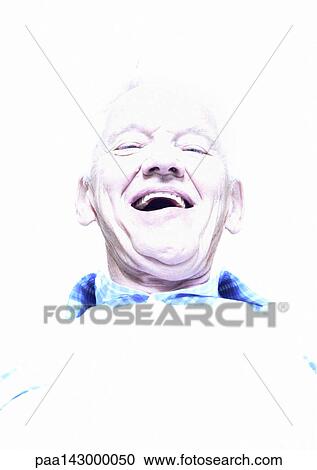 Stock Image - Elderly man laughing, low angle view, portrait. Fotosearch