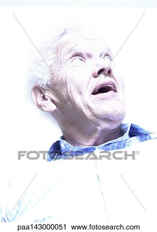 Elderly man looking up, low angle view, portrait View Large Photo Image Stock Image - Elderly man looking up, low angle view, portrait. Fotosearch