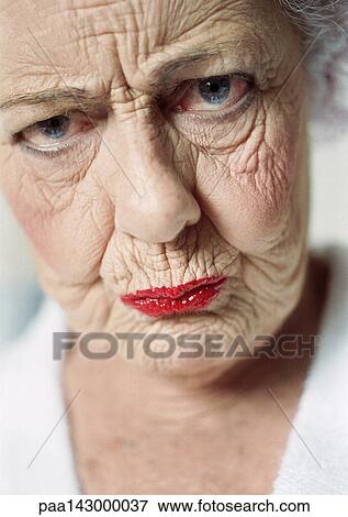 Stock Photo - Elderly woman frowning, portrait, close-up. Fotosearch