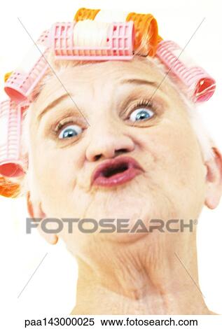 Elderly woman puckering lips and wearing hair rollers, portrait, close-up View Large Photo Image Stock Photography - Elderly woman puckering lips and wearing hair rollers, portrait, close-up. Fotosearch