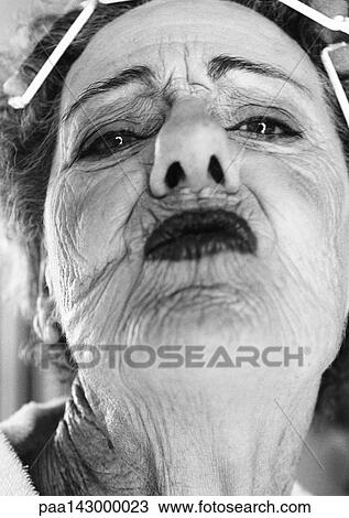 Elderly woman puckering lips, portrait, close-up, b&w View Large Photo Image Stock Image - Elderly woman puckering lips, portrait, close-up, b&w. Fotosearch