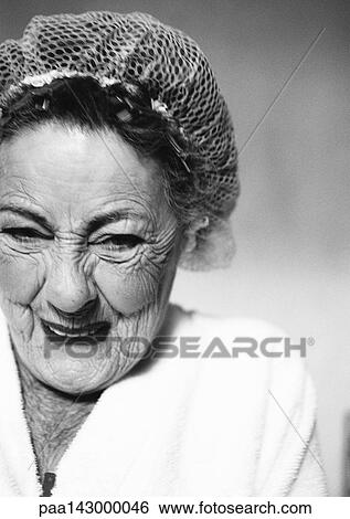 Elderly woman wearing hair net, smiling, portrait, close-up, b&w View Large Photo Image Stock Photograph - Elderly woman wearing hair net, smiling, portrait, close-up, b&w. Fotosearch