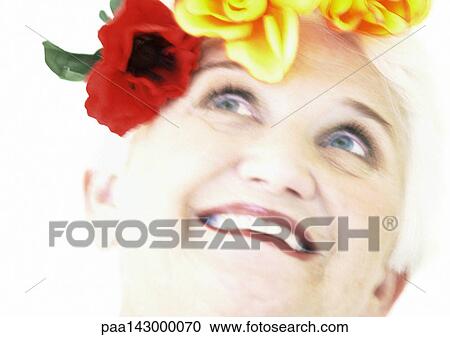 Elderly woman with flowers on head looking up, portrait, close-up, blurred View Large Photo Image Stock Image - Elderly woman with flowers on head looking up, portrait, close-up, blurred. Fotosearch