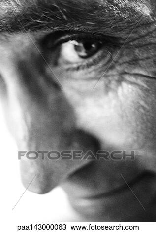 Mature man looking at camera, extreme close-up, b&w View Large Photo Image Stock Image - Mature man looking at camera, extreme close-up, b&w. Fotosearch
