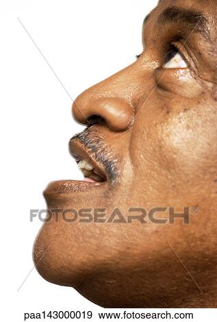 Mature man looking up, side view, portrait, close-up View Large Photo Image Stock Photo - Mature man looking up, side view, portrait, close-up. Fotosearch