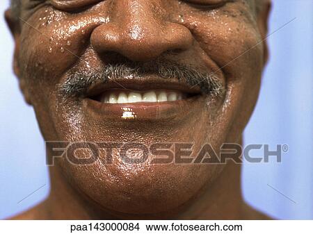 Picture - Mature man smiling, lower part of face, close-up. Fotosearch