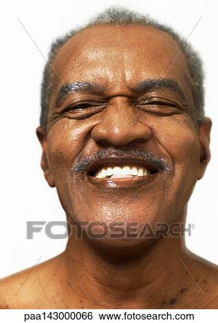 Stock Photograph - Mature man smiling, portrait, close-up. Fotosearch