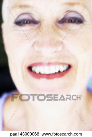 Mature woman looking at camera, close-up, portrait, blurred View Large Photo Image Stock Photo - Mature woman looking at camera, close-up, portrait, blurred. Fotosearch