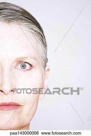 Mature woman looking at camera, close-up, partial view View Large Photo Image Stock Photograph - Mature woman looking at camera, close-up, partial view. Fotosearch