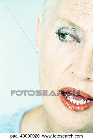 Mature woman looking to the side with mouth open, close-up, partial view View Large Photo Image Stock Image - Mature woman looking to the side with mouth open, close-up, partial view. Fotosearch
