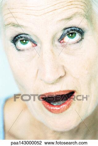 Mature woman looking up with mouth open, close-up, portrait View Large Photo Image Stock Image - Mature woman looking up with mouth open, close-up, portrait. Fotosearch