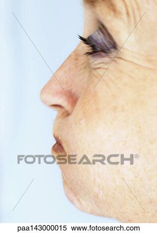 Mature woman puffing out cheeks, close-up, side view View Large Photo Image Stock Photography - Mature woman puffing out cheeks, close-up, side view. Fotosearch
