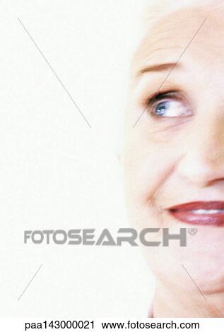Senior woman raising eyebrows and looking up, close-up, partial view View Large Photo Image Stock Image - Senior woman raising eyebrows and looking up, close-up, partial view. Fotosearch