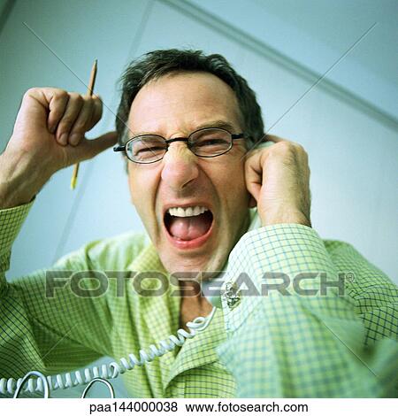 Man holding phone, shouting, portrait View Large Photo Image Stock Photo - Man holding phone, shouting, portrait. Fotosearch