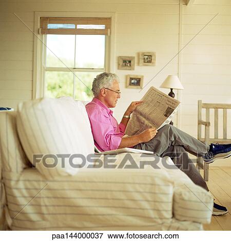 Picture Of Man Sitting On Sofa Reading Newspaper Side View Man Sitting On Sofa Reading Newspaper Side View