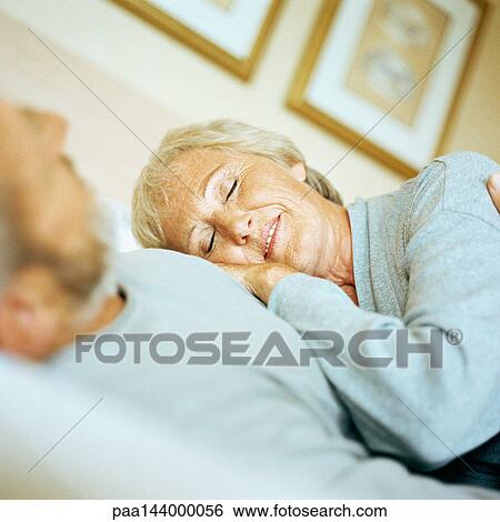 Mature woman leaning on man View Large Photo Image Stock Photograph - Mature woman leaning on man. Fotosearch