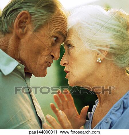 Senior man and woman having argument, side view View Large Photo Image Stock Image - Senior man and woman having argument, side view. Fotosearch