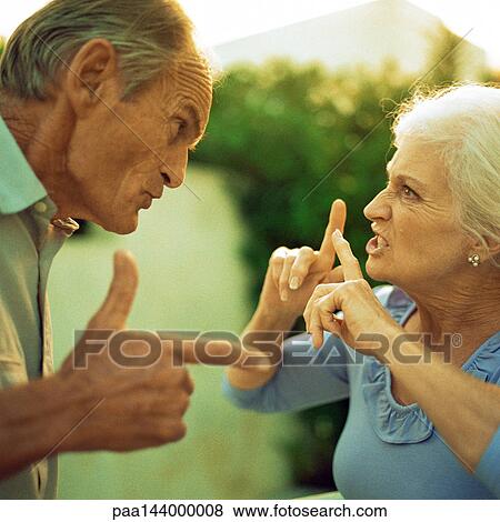Senior man and woman having argument, side view View Large Photo Image Stock Photo - Senior man and woman having argument, side view. Fotosearch