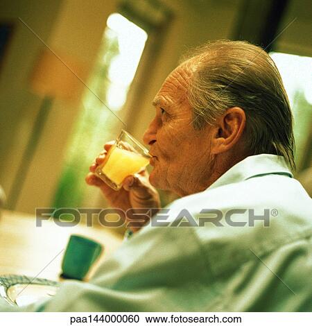 Senior man drinking from glass, side view View Large Photo Image Stock Image - Senior man drinking from glass, side view. Fotosearch