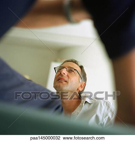 Mature man looking up, blurred foreground View Large Photo Image Stock Image - Mature man looking up, blurred foreground. Fotosearch