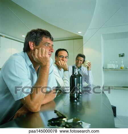 Three men with elbows on counter View Large Photo Image Stock Photo - Three men with elbows on counter. Fotosearch
