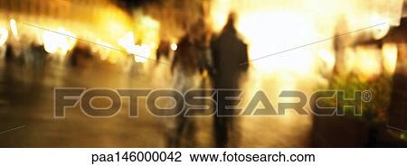 Couple walking at night, blurred View Large Photo Image Stock Image - Couple walking at night, blurred. Fotosearch
