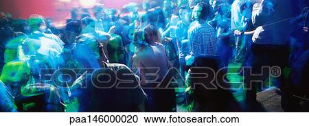 Crowd of people dancing at a nighclub View Large Photo Image Stock Image - Crowd of people dancing at a nighclub. Fotosearch