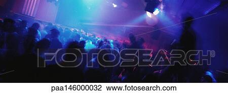 Crowd of people dancing at nightclub View Large Photo Image Stock Image - Crowd of people dancing at nightclub. Fotosearch