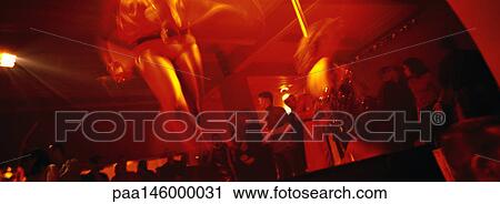 Dancer dancing in nightclub, blurred View Large Photo Image Stock Image - Dancer dancing in nightclub, blurred. Fotosearch