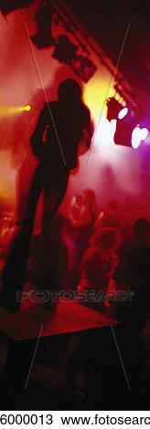 Dancer on platform in nightclub, silhouette View Large Photo Image Stock Image - Dancer on platform in nightclub, silhouette. Fotosearch