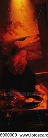 Dj spinning records in dark venue, blurred View Large Photo Image Stock Photo - Dj spinning records in dark venue, blurred. Fotosearch