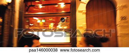 Man and woman face to face in front of building facade, partial view, blurred View Large Photo Image Stock Photo - Man and woman face to face in front of building facade, partial view, blurred. Fotosearch