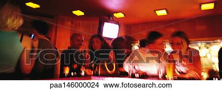 People standing at bar in nightclub, blurred View Large Photo Image Picture - People standing at bar in nightclub, blurred. Fotosearch