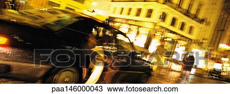Person getting out of taxi at night, blurred View Large Photo Image Stock Image - Person getting out of taxi at night, blurred. Fotosearch