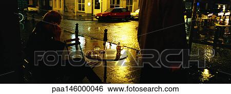 Person sitting at cafe terrace at night View Large Photo Image Stock Photograph - Person sitting at cafe terrace at night. Fotosearch