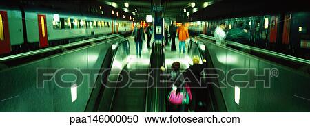 Subway trains waiting at platform and escalators, panoramic view View Large Photo Image Stock Image - Subway trains waiting at platform and escalators, panoramic view. Fotosearch