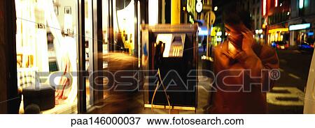Urban street scene at night, blurred motion View Large Photo Image Stock Photo - Urban street scene at night, blurred motion. Fotosearch