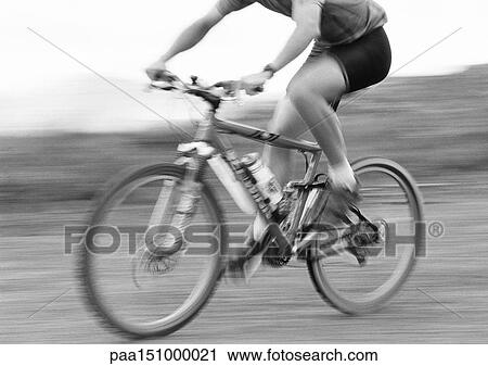 Man cycling, blurred, b&w. View Large Photo Image Stock Image - Man cycling, blurred, b&w.. Fotosearch