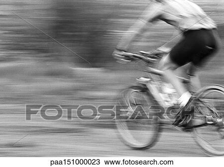 Man cycling, side view, blurred, b&w. View Large Photo Image Stock Image - Man cycling, side view, blurred, b&w. . Fotosearch