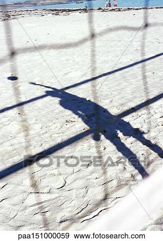 Shadow of someone playing beach volleyball. View Large Photo Image Stock Photo - Shadow of someone playing beach volleyball.. Fotosearch
