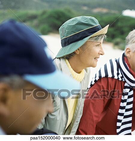 Mature adults on beach, foreground blurred, portrait. View Large Photo Image Stock Image - Mature adults on beach, foreground blurred, portrait.. Fotosearch
