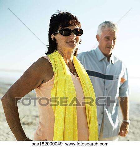 Mature couple standing on beach, portrait. View Large Photo Image Stock Photo - Mature couple standing on beach, portrait.. Fotosearch